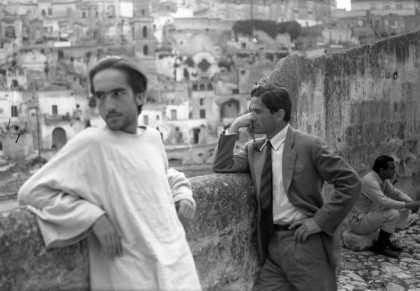 Pier Paolo Pasolini and Enrique Irazoqui during a break on the set of "Il Vangelo secondo Matteo", in front of Sassi di Matera panorama, June 1964  @ Associazione Pasolini Matera, photo Archivio Notarangelo