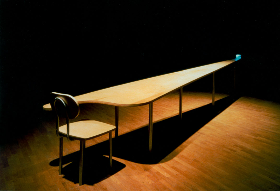 GARY HILL Learning Curve (Still point), 1993 Single channel video installation. Silent. One five inch color monitor. Plywood chair/table construction Lunghezza Tavolo 560 cm. Edition of 2
