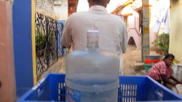 Labour in a Single Shot. A project by Antje Ehmann and Harun Farocki. Watercan Delivery, Bangalore 2012. Filmstill  © Nikhil Patil, Arav Narang